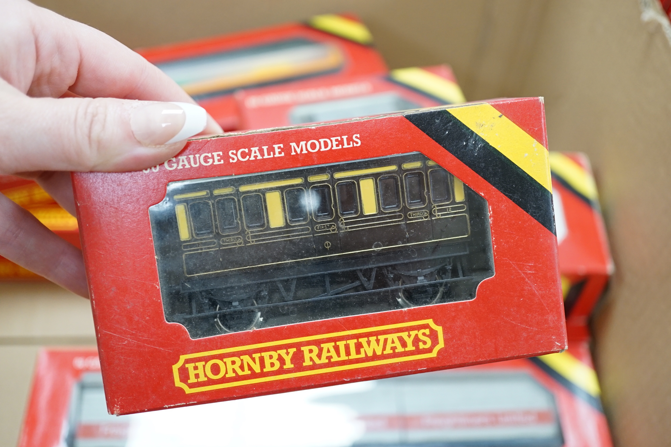Thirty-six boxed Hornby railways 00 gauge items including five BR diesel locomotives; a Class 47 (R075), a Hymek (R074), a Class 25 (R068) and two Class 08 shunters (R156), together with fifteen freight wagons, twelve bo